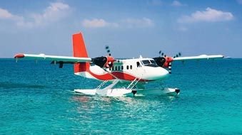 Seaplane operating over coastal water